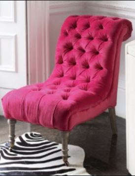 An antique nursing chair re-upholstered in a contemporary pop-coloured fabric