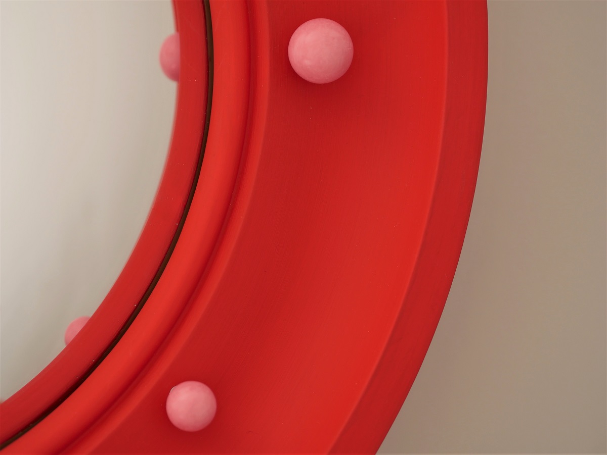 red convex mirror with pink ball details image