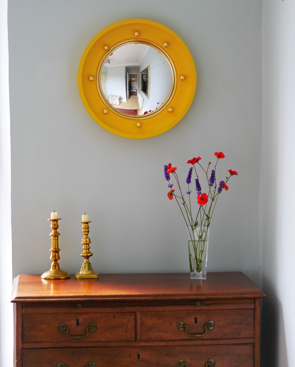 yellow globe convex mirror with gold leaf balls image