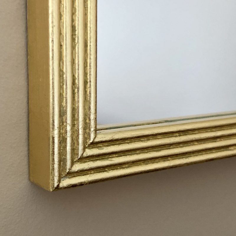 gilt mirror with reeded wooden frame profile